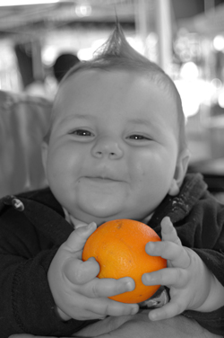 Baby With Orange