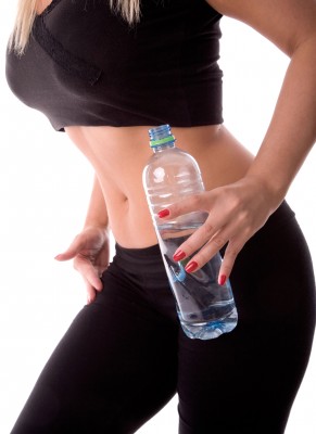 Very fit woman with water bottle