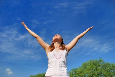 Woman with arms stretched overhead | FearlessFatLoss.com